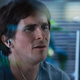Christian Bale as investor Michael Burry in The Big Short looking quizzically at a computer screen.